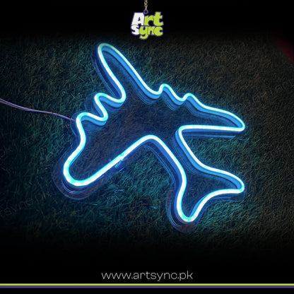 Neon light shaped like an airplane on a dark background with 'Art Sync' branding.